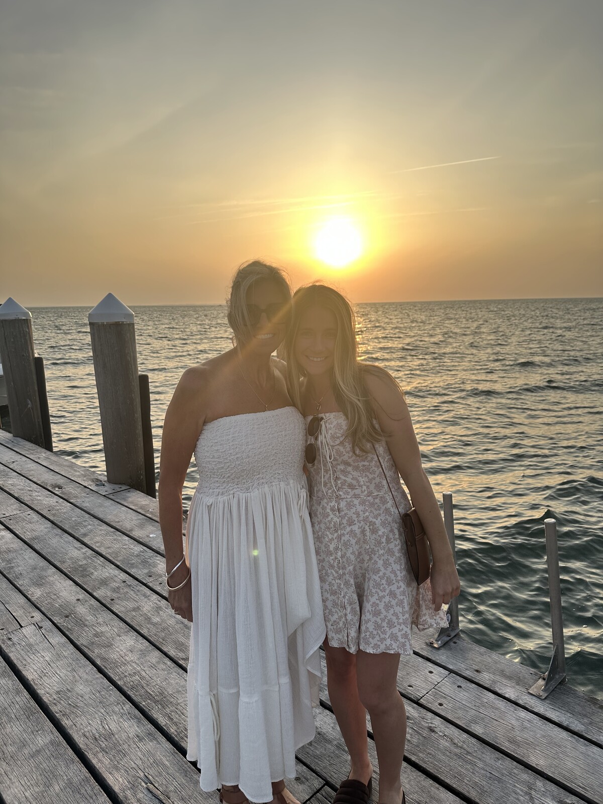 The founders together on a dock in Mystic at sunset